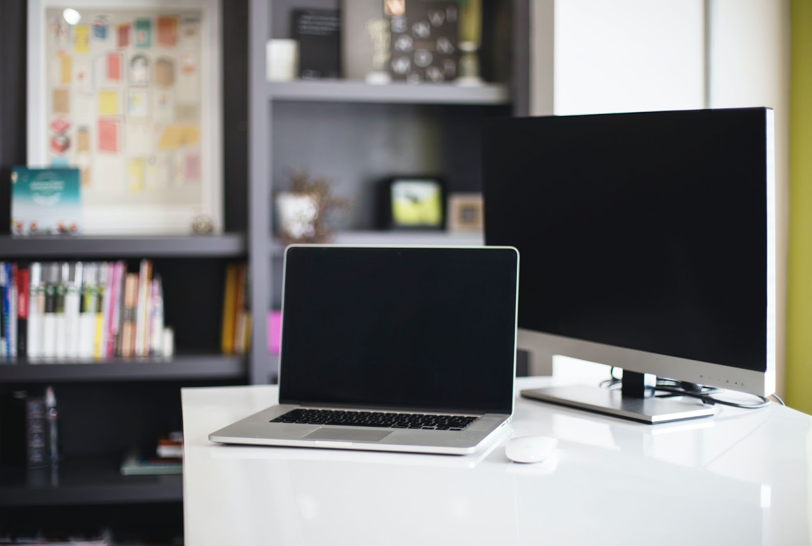 a laptop and desktop computer plugged into a portable power station.